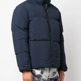 Blue jackets worn by a person, showing the jackets fit