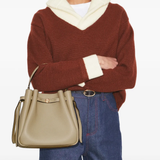 Brown bag worn by a person, showing the bag's fit