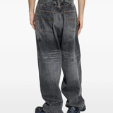 Grey pants worn by a person, showing the pants fit