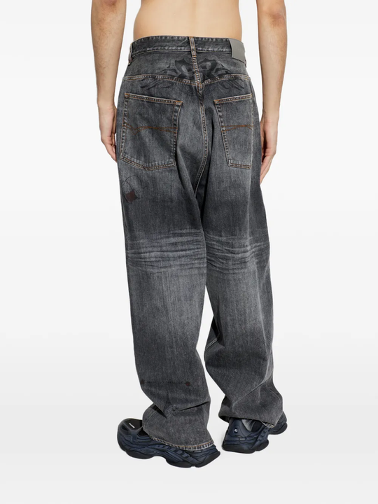 Grey pants worn by a person, showing the pants fit