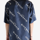 Navy shirt worn by a person, showing the shirt's fit