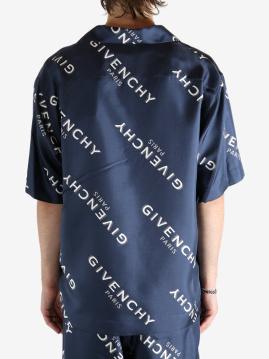 Navy shirt worn by a person, showing the shirt's fit