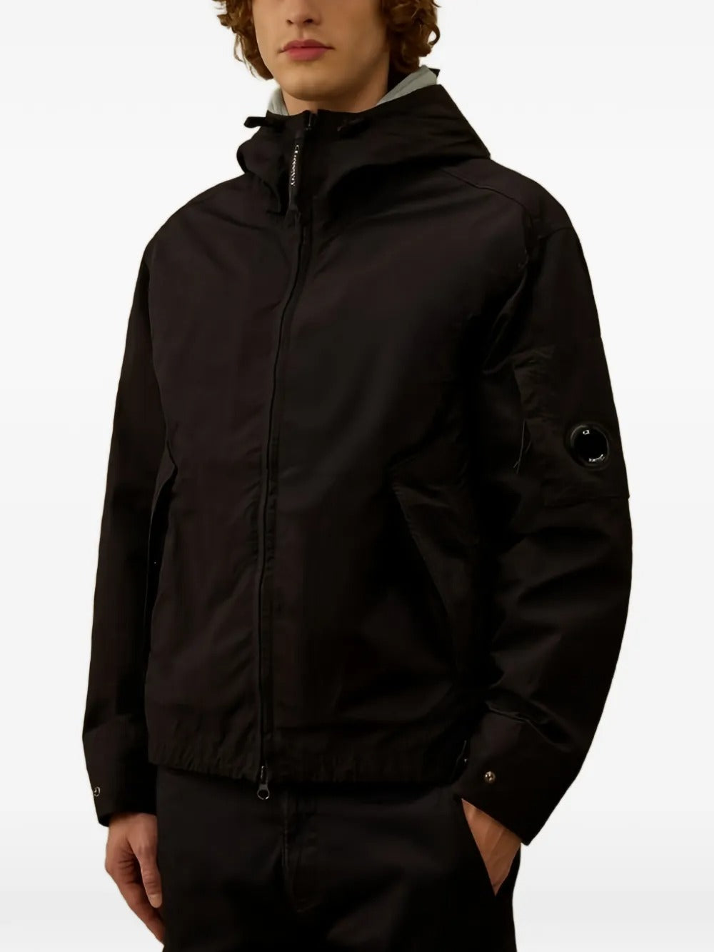 Black jacket worn by a person, showing the jacket's fit