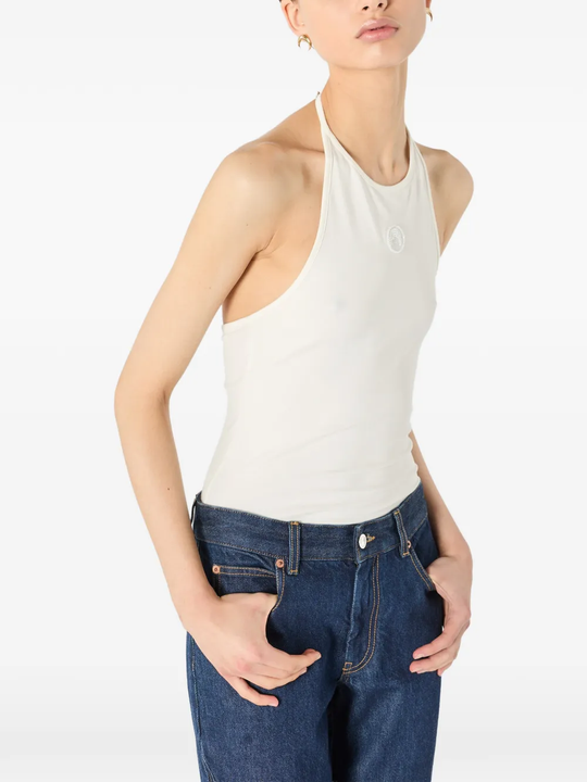White tops worn by a person, showing the tops' fit