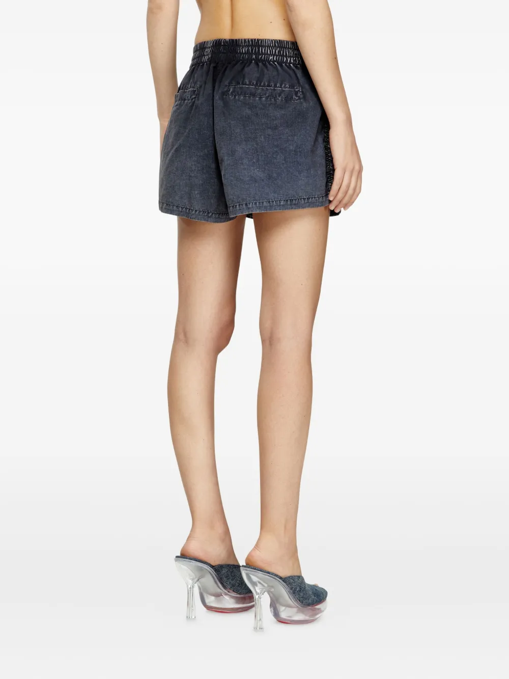 Blue shorts worn by a person, showing the shorts's fit