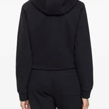 Black hoodie worn by a person, showing the hoodie's fit