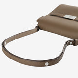 Close up of brown bag, showing texture of the leather fabric