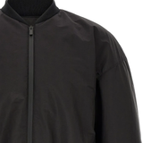 Close up of Black jacket, showing texture of the polyester fabric