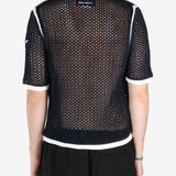 Black shirts worn by a person, showing the shirts fit