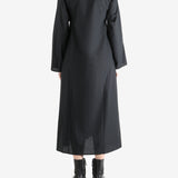 Black dresses worn by a person, showing the dresses fit