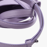 Close up of the purple bag, showing texture of the leather fabric