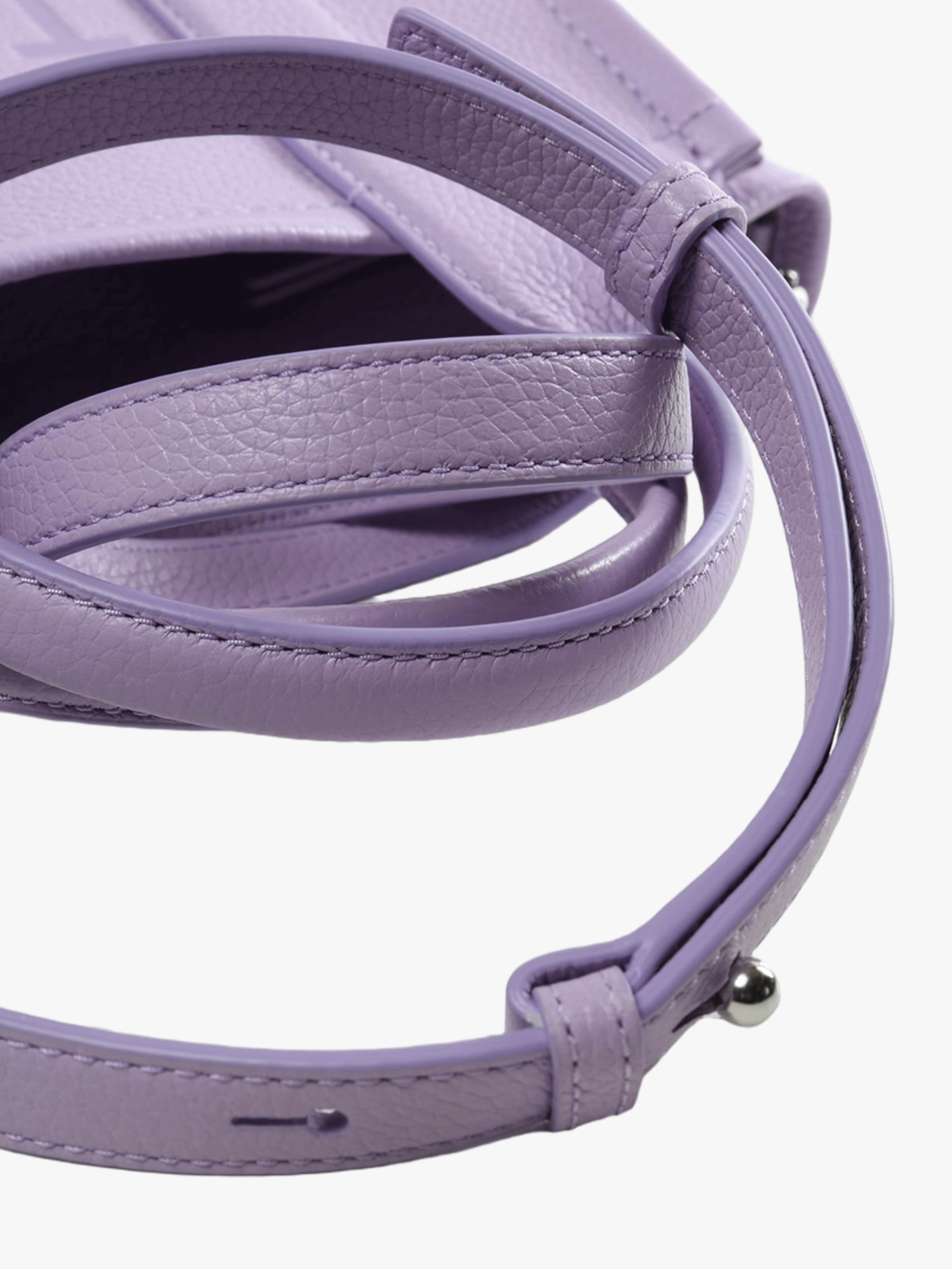 Close up of the purple bag, showing texture of the leather fabric