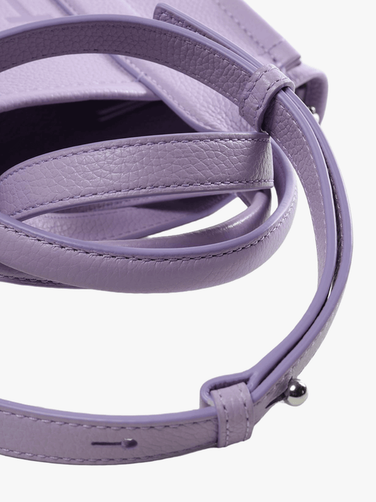 Close up of the purple bag, showing texture of the leather fabric