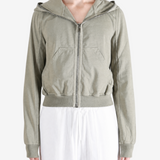 Green hoodie worn by a person, showing the hoodie fit
