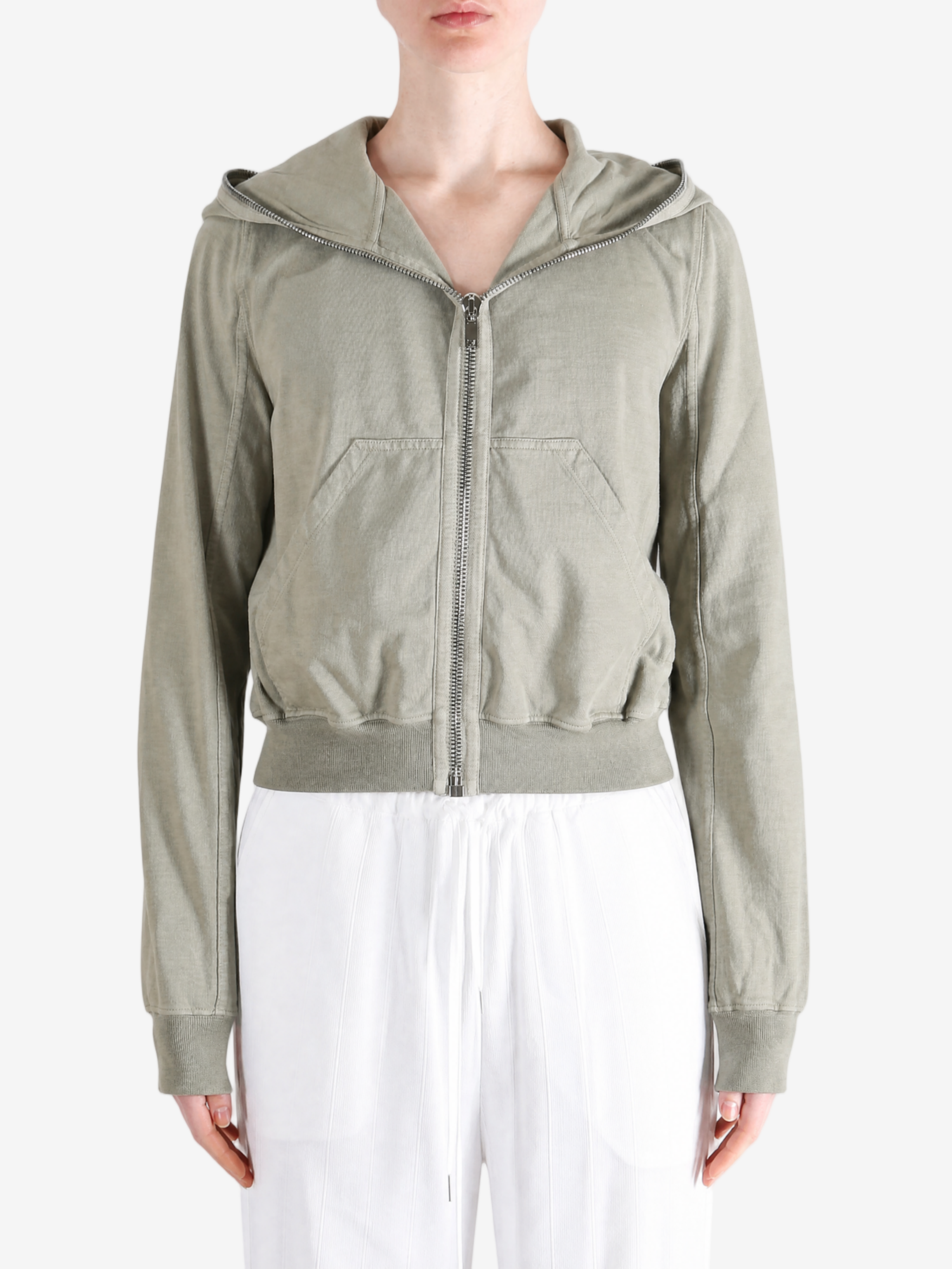 Green hoodie worn by a person, showing the hoodie fit