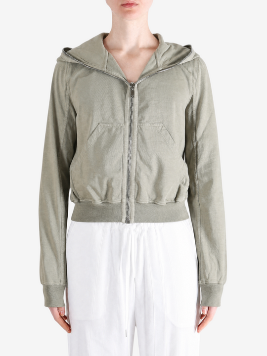 Green hoodie worn by a person, showing the hoodie fit