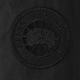 Close up of the black jacket, showing texture of the polyester fabric