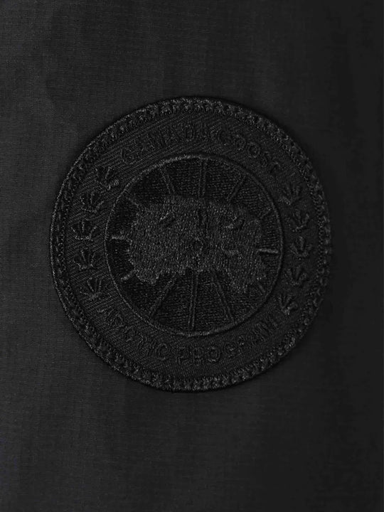 Close up of the black jacket, showing texture of the polyester fabric