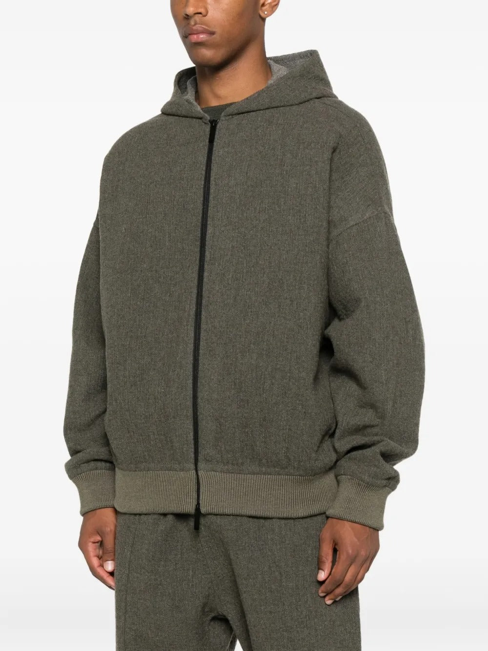 Black hoodie worn by a person, showing the hoodie's fit