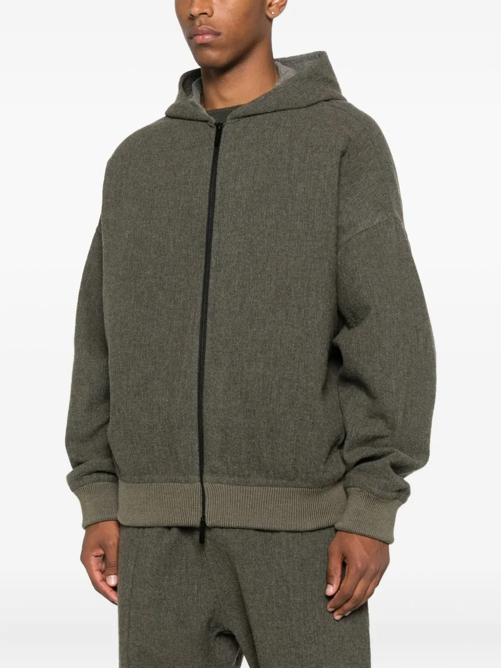 Black hoodie worn by a person, showing the hoodie's fit