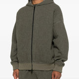 Black hoodie worn by a person, showing the hoodie's fit