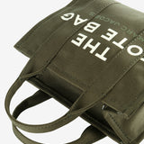 Close up of green bag,showing texture of the cotton fabric.