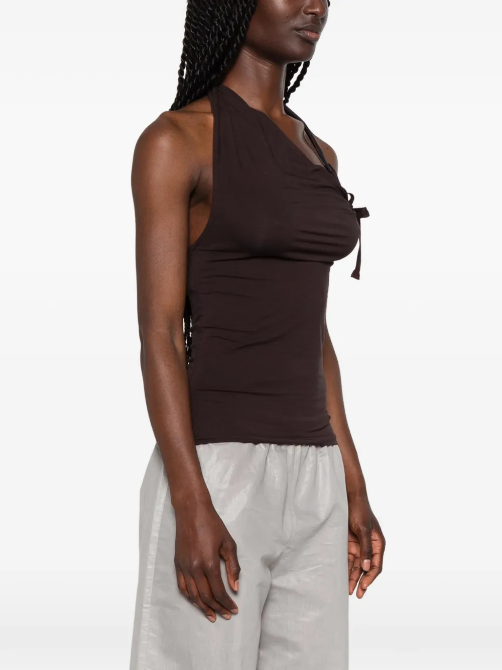 Brown top worn by a person, showing the top's fit