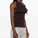 Brown top worn by a person, showing the top's fit