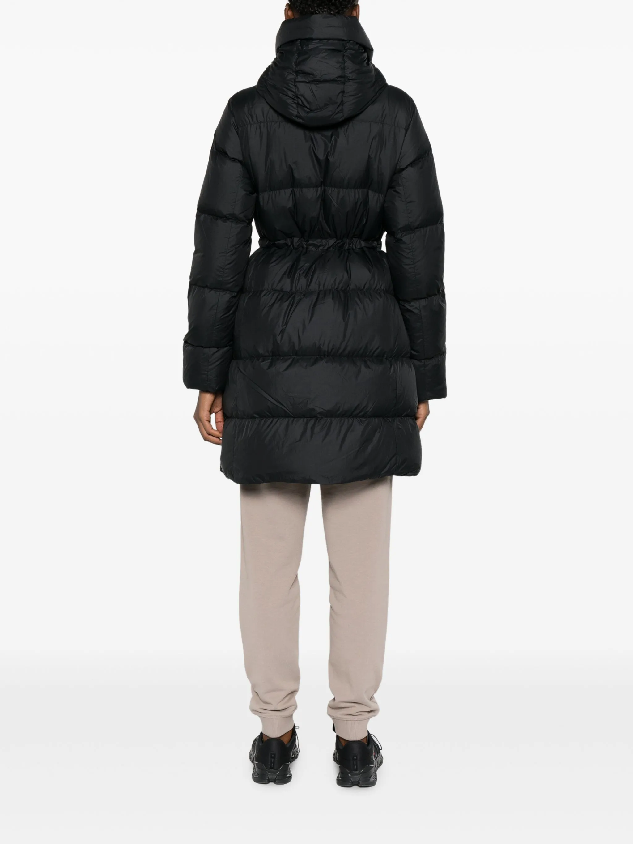 Black coat  worn by a person, showing the coat's fit