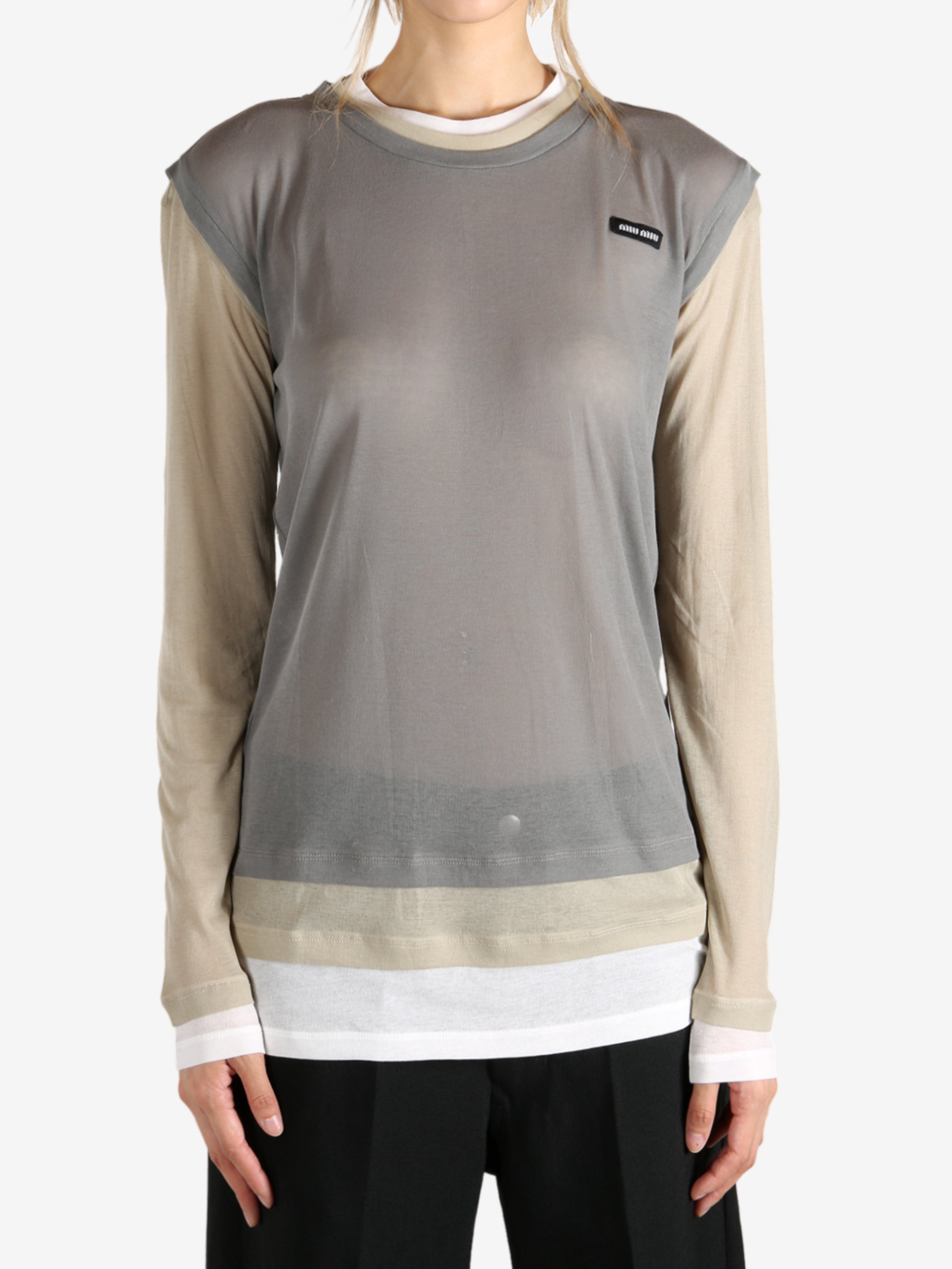 Tan top worn by a person, showing the top fit