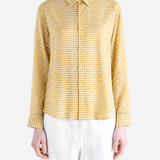 Yellow shirt worn by a person, showing the shirt fit