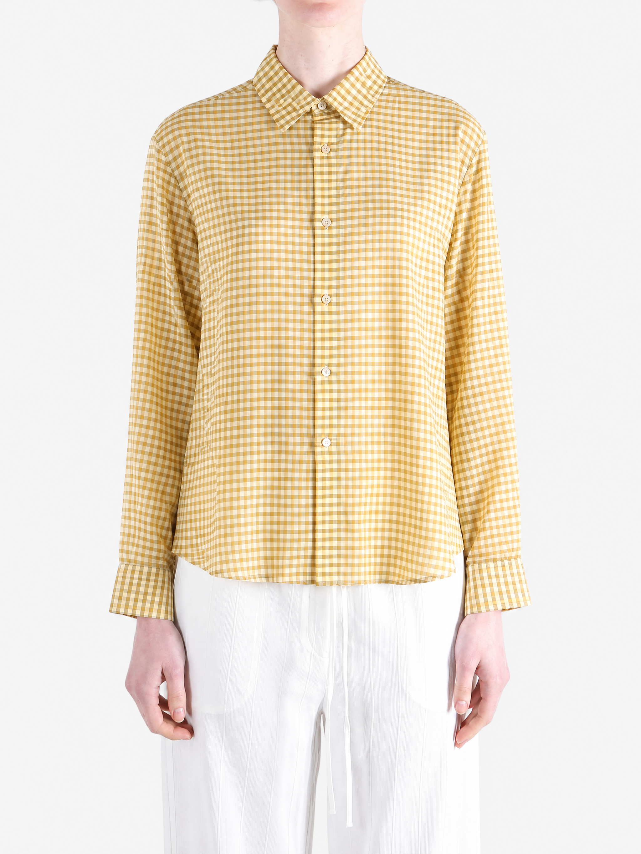 Yellow shirt worn by a person, showing the shirt fit