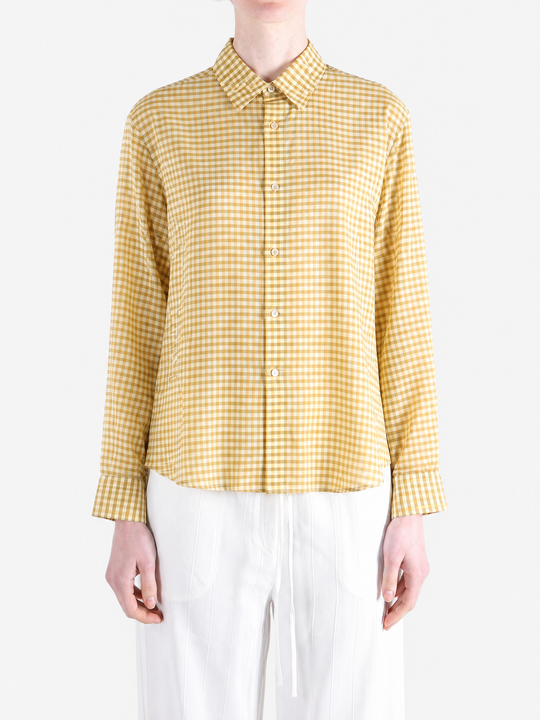 Yellow shirt worn by a person, showing the shirt fit