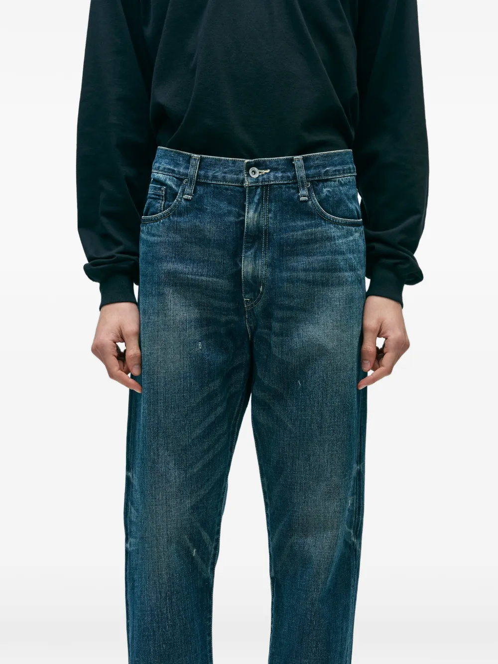 Blue pants worn by a person, showing the pants fit