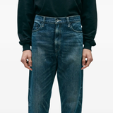 Blue pants worn by a person, showing the pants fit