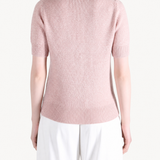 Pink shirt worn by a person, showing the shirt fit