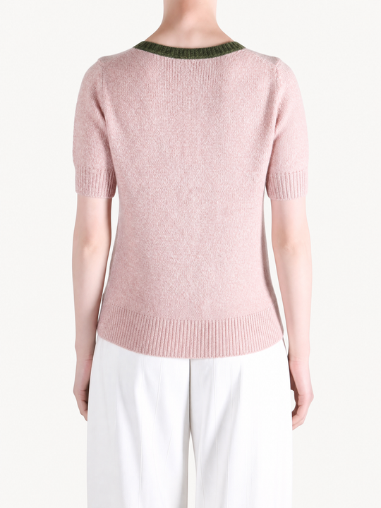 Pink shirt worn by a person, showing the shirt fit
