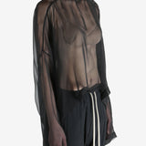 Black top worn by a person, showing the top's fit