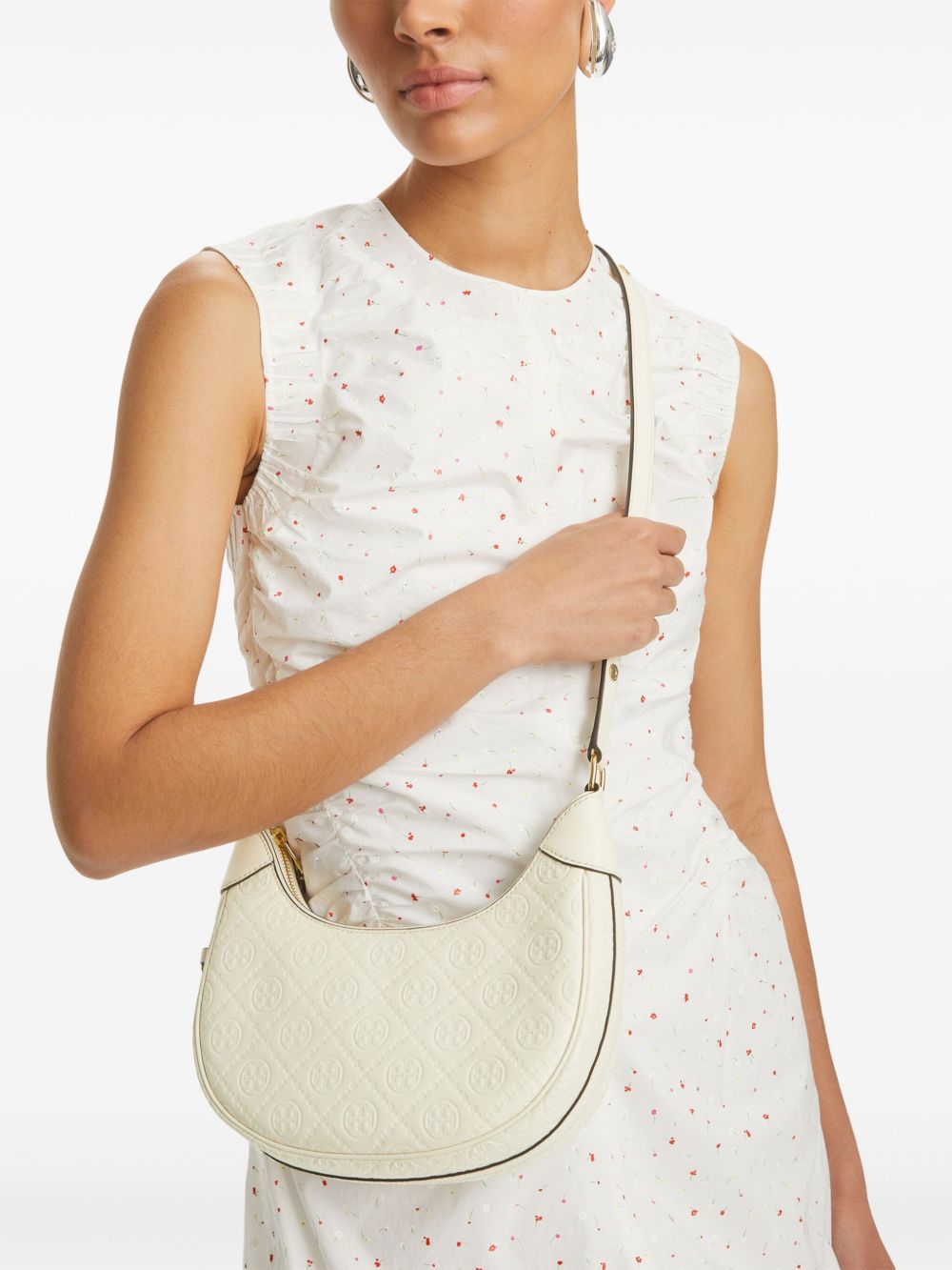 Tan bag carried by a person, showing the bag's fit