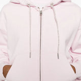  Close up of pink hoodie, showing texture of the cotton fabric
