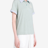 Green t-shirt worn by a person, showing the t-shirt fit