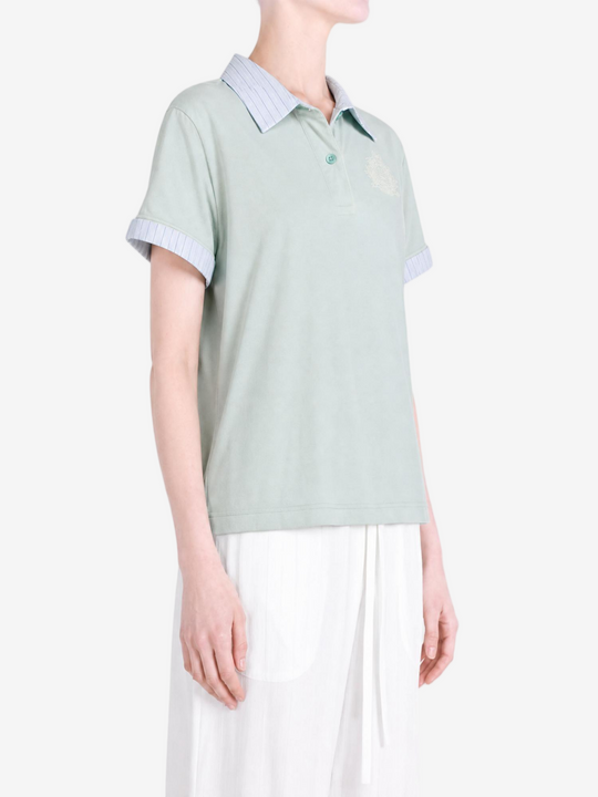 Green t-shirt worn by a person, showing the t-shirt fit