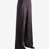 Red pant worn by a person, showing the pant's fit