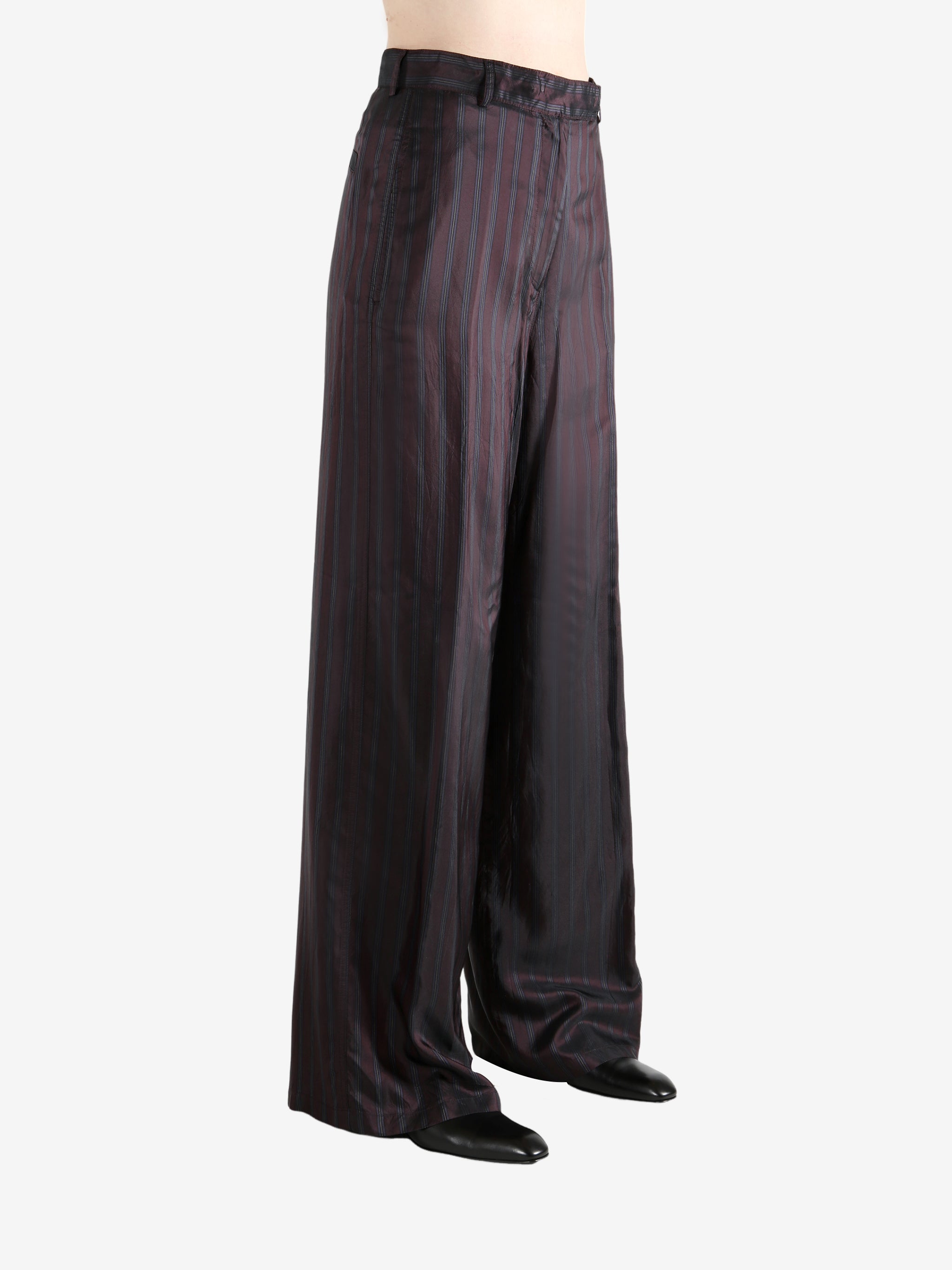 Red pant worn by a person, showing the pant's fit