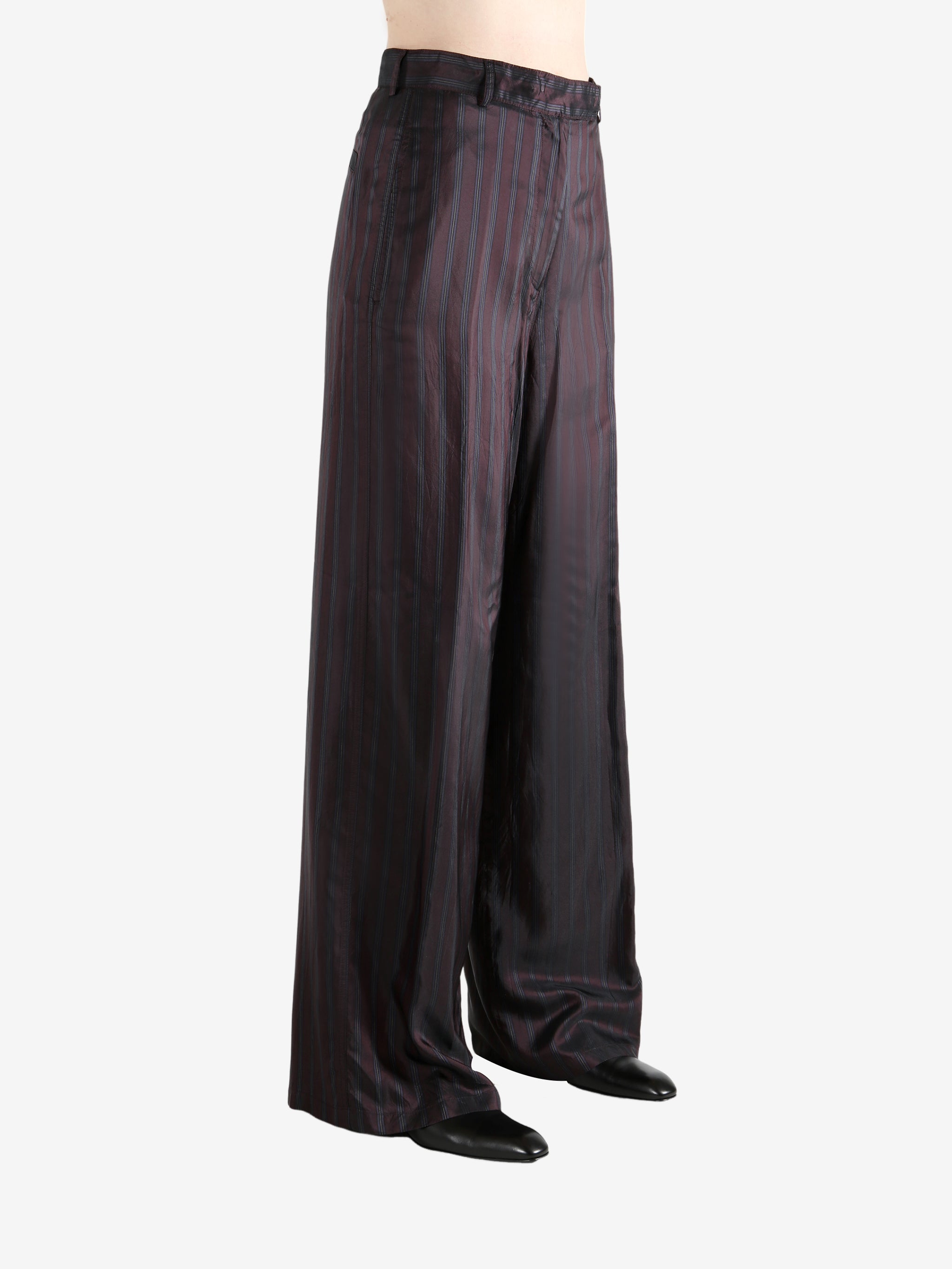 Red pant worn by a person, showing the pant's fit