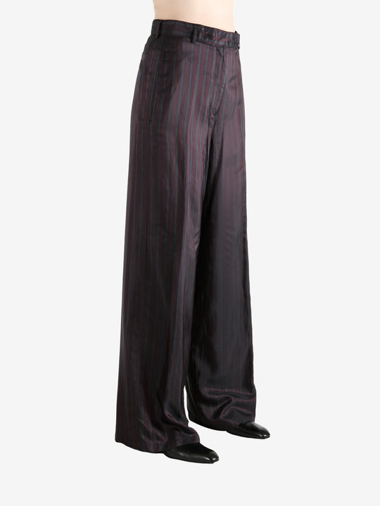 Red pant worn by a person, showing the pant's fit