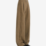 Brown pants worn by a person, showing the pants fit