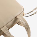 Close up of tan bags, showing texture of the blended fabric