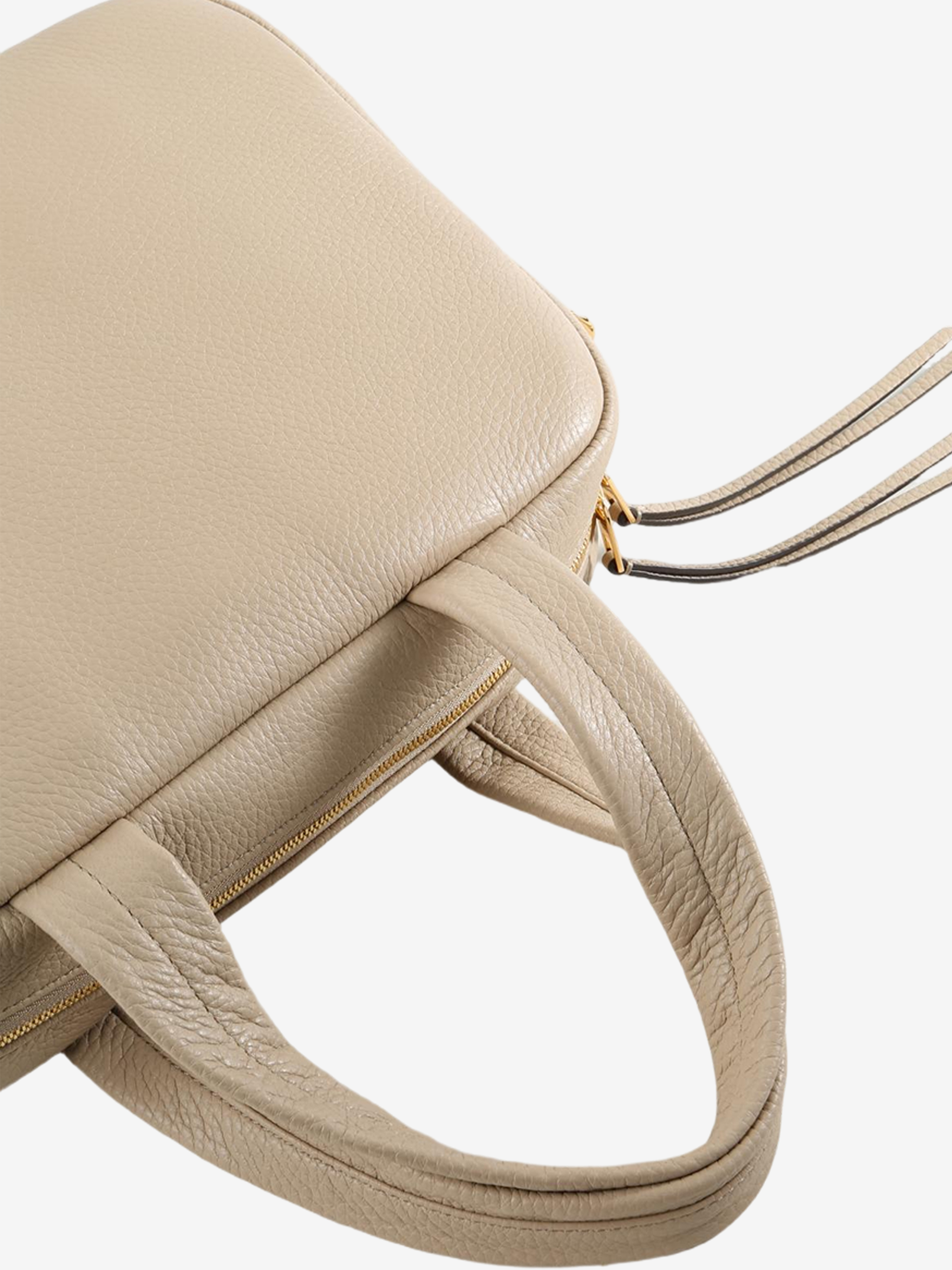 Close up of tan bags, showing texture of the blended fabric
