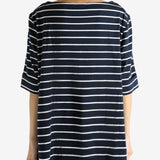 Navy top worn by a person, showing the top's fit